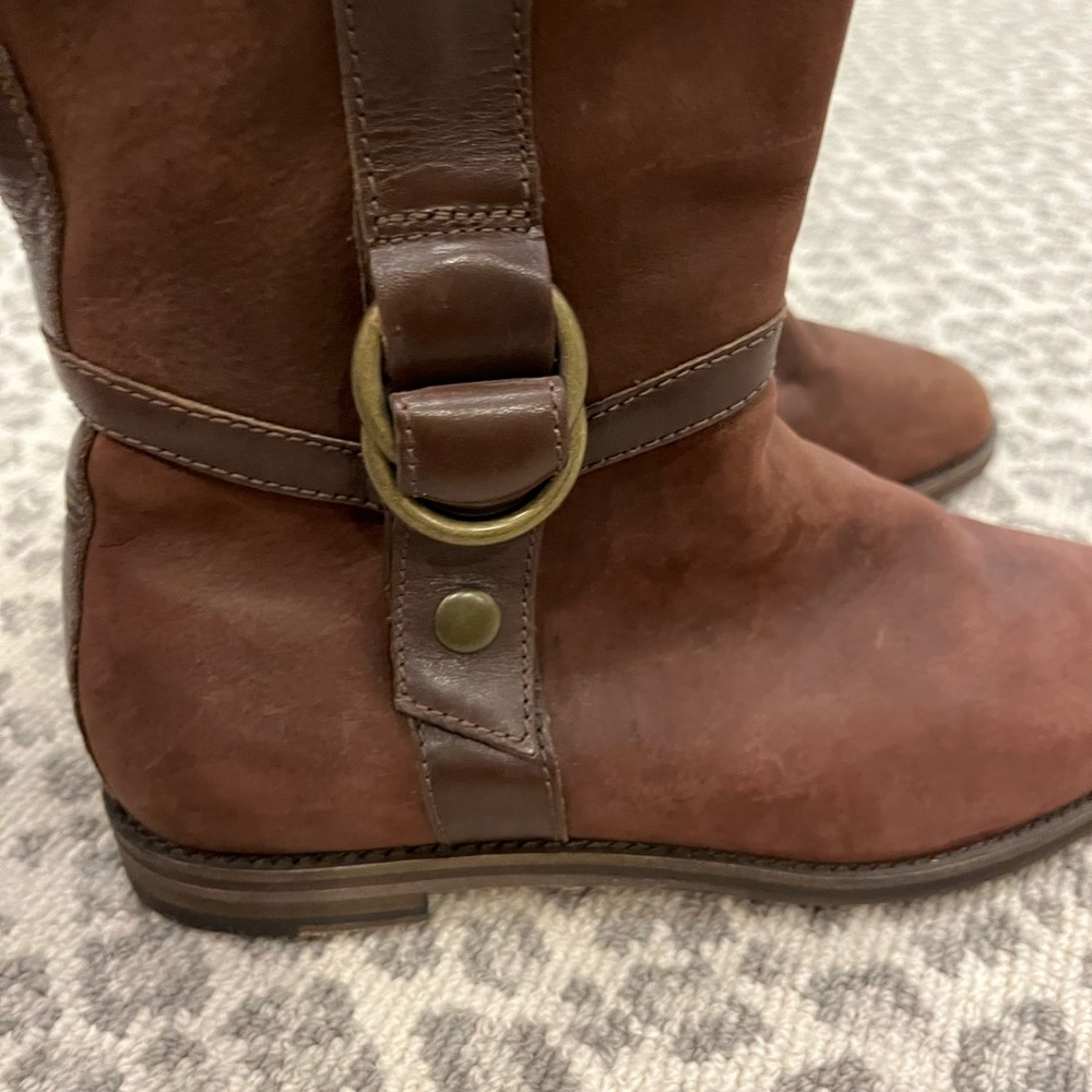 Cole Haan classic leather riding boot style with buckle detail w/Nike Air sole.